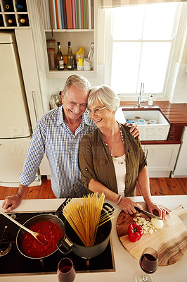 Buy stock photo Affection, smile or happy old couple kitchen cooking with love or healthy food for dinner together at home. Embrace or above of senior woman helping or hugging an elderly husband in meal preparation