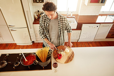 Buy stock photo Food, cooking or above of man in kitchen with healthy vegan diet for nutrition or vegetables at home in Australia. Wine glass, spaghetti or male person in house kitchen in preparation for dinner meal