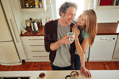 Buy stock photo Hugging, tea or happy couple laughing in kitchen at home bonding or enjoying quality time together. Embrace, affection or above of funny mature man relaxing or drinking coffee with woman at home 