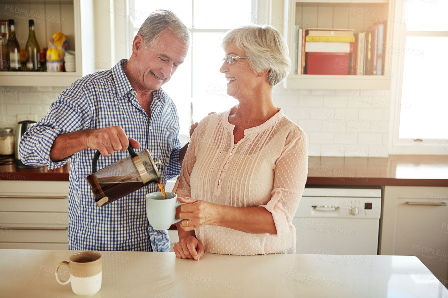 Buy stock photo Happy, coffee or old couple talking in a kitchen at home bonding or enjoying quality morning time together. Love, wellness or mature man in conversation, relaxing or drinking espresso tea with woman