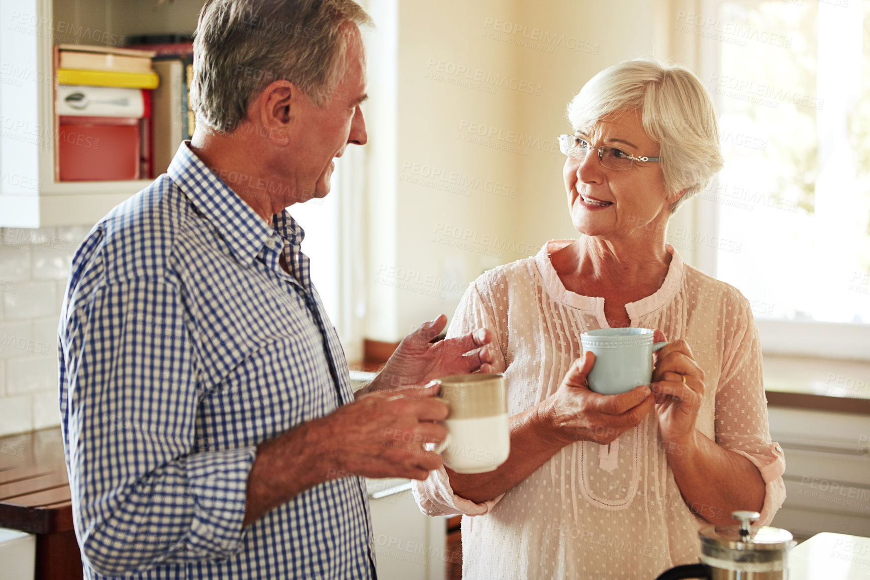 Buy stock photo Chat, coffee or old couple talking in kitchen at home bonding or enjoying quality morning time together. Happy, retirement or senior man speaking, relaxing or drinking tea espresso with woman at home