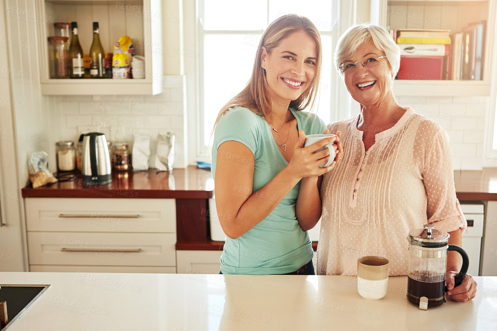 Buy stock photo Portrait of mother, coffee or happy woman in kitchen in family home bonding or enjoying quality time together. Embrace, retirement or daughter talking, relaxing or drinking tea with senior person 