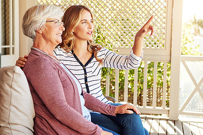 Buy stock photo Cropped shot of a senior woman sitting outside with her adult daughter