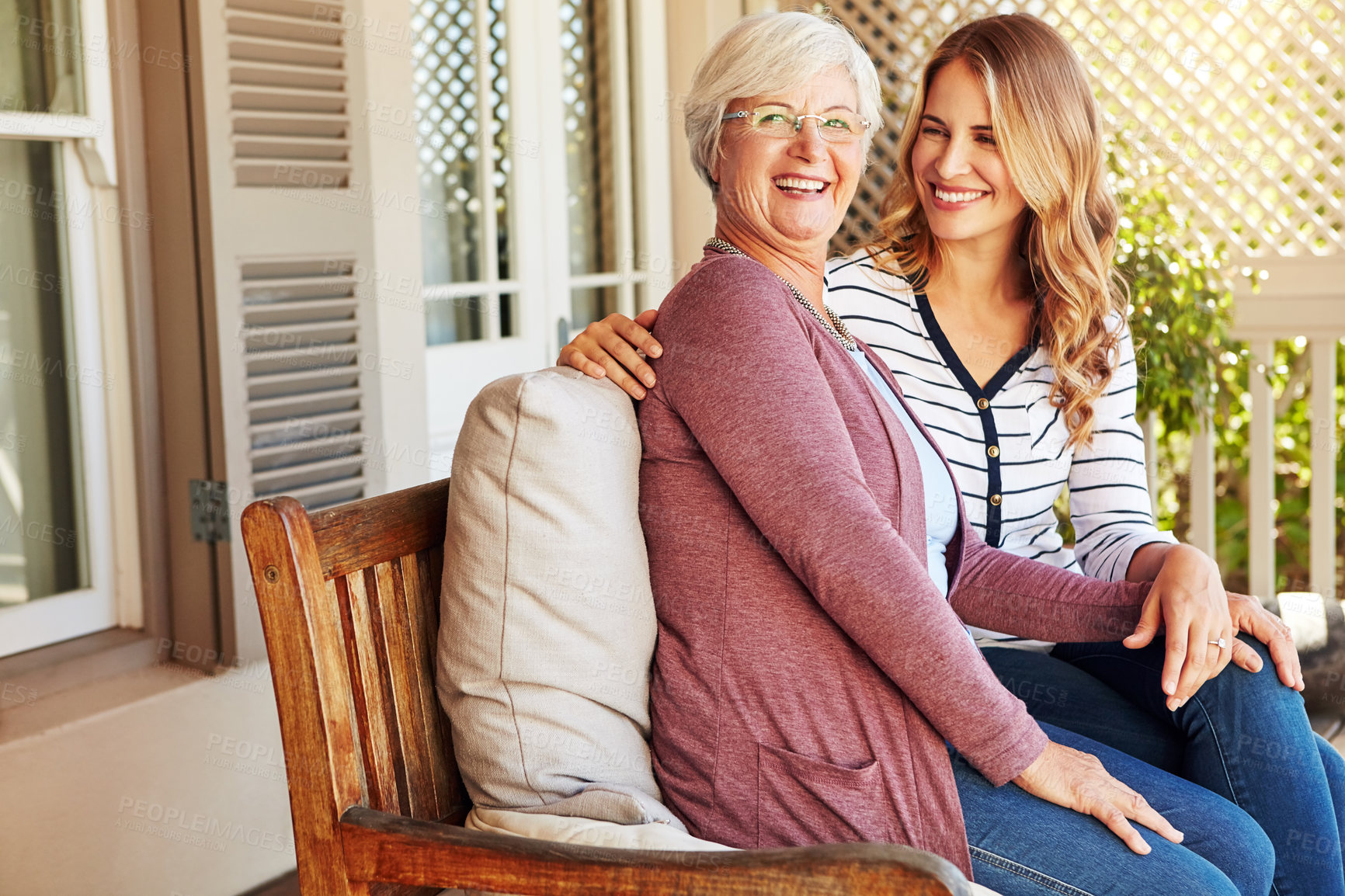 Buy stock photo Cropped portrait of a senior woman sitting outside with her adult daughter
