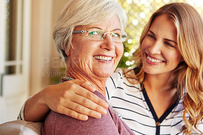 Buy stock photo Cropped portrait of a senior woman sitting outside with her adult daughter