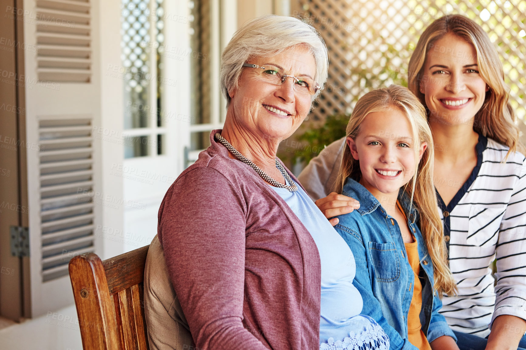 Buy stock photo Women, family and portrait of generations with mother, grandmother and child together on patio. Backyard, smile and bonding with love, care and trust with grandma and thanksgiving reunion at home