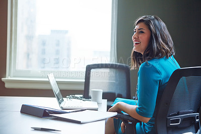 Buy stock photo Shot of a businesswoman working at her desk in an office