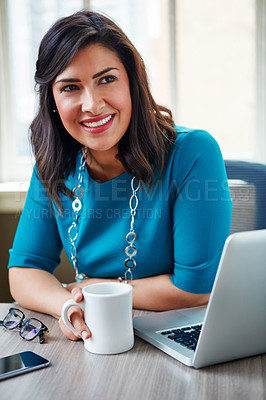 Buy stock photo Shot of a businesswoman taking a break at her desk in an office