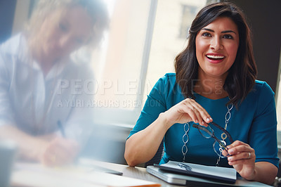 Buy stock photo Shot of two businesswomen having a meeting together in an office