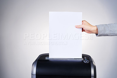 Buy stock photo Studio shot of paper being shredded