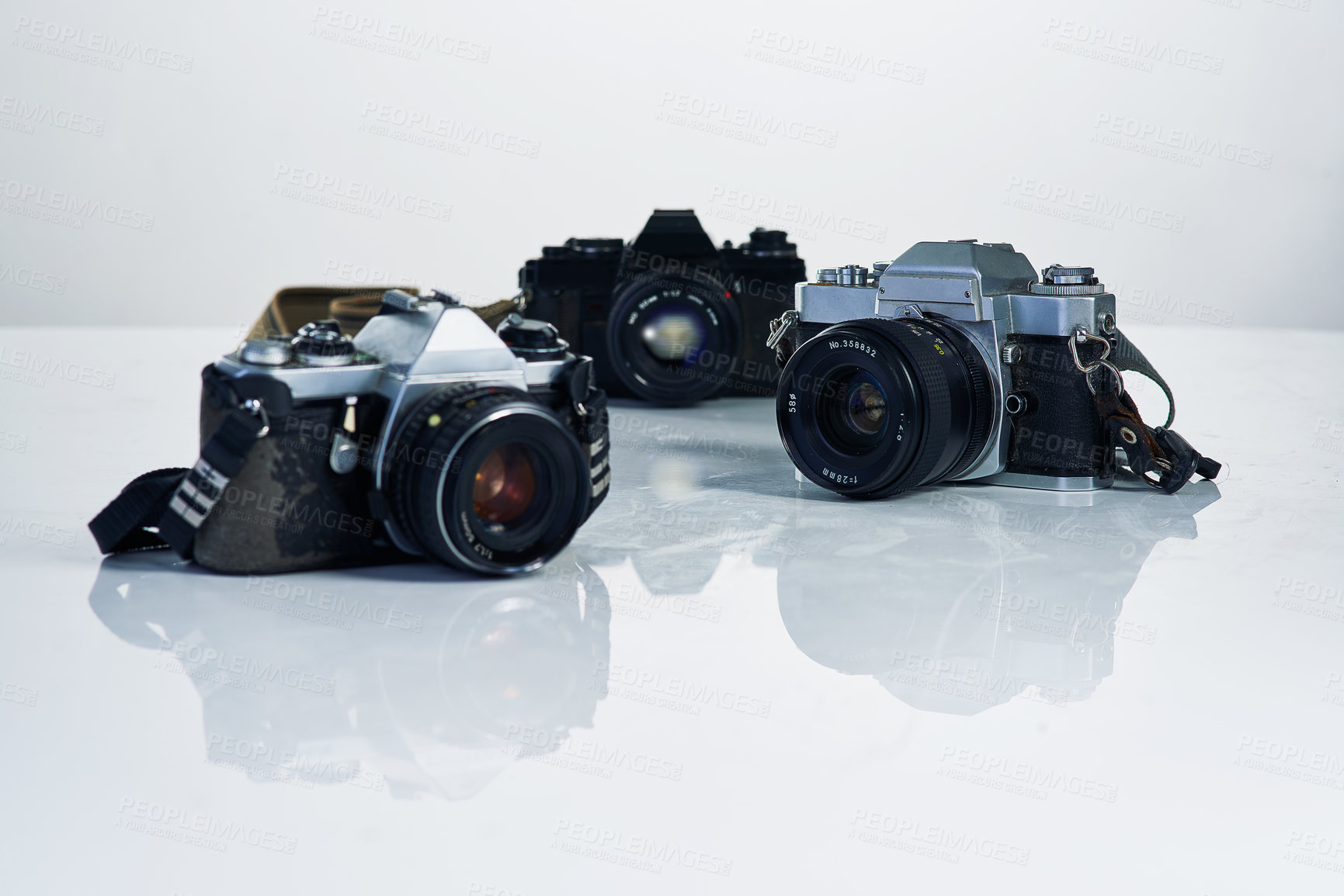 Buy stock photo Studio shot of various cameras and their accessories