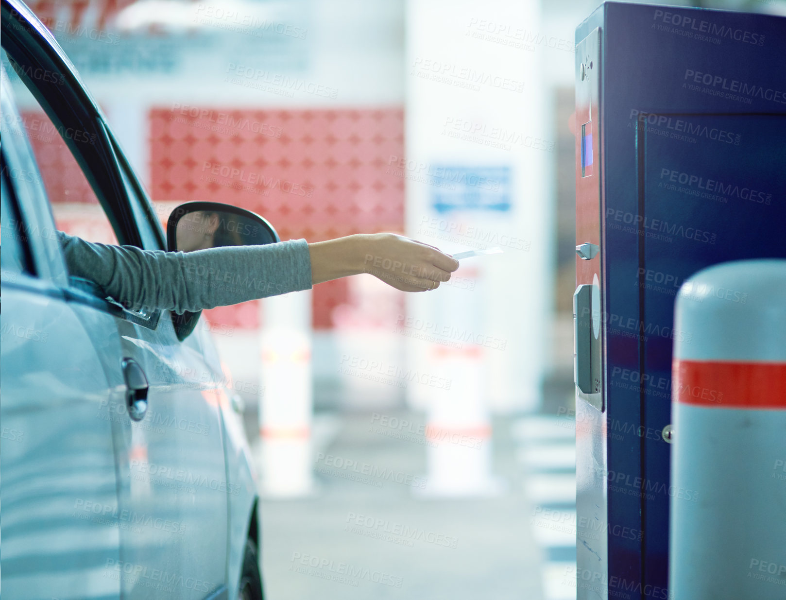 Buy stock photo Shot of an unrecognizable driver inserting a ticket into a parking meter