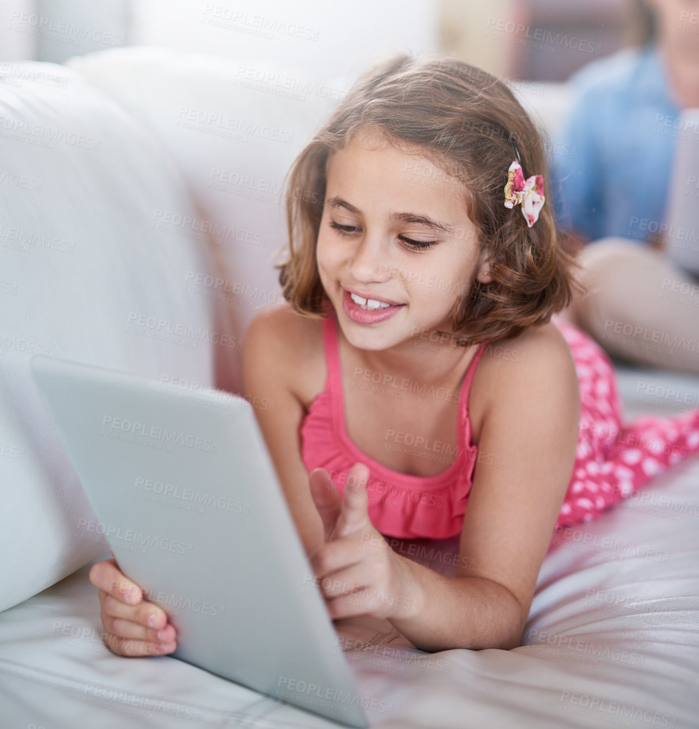 Buy stock photo Girl, child and relax on sofa with tablet for games, movies or elearning platform with happiness and development. Internet, streaming and subscription with ebook on online education website at home