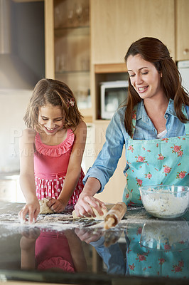 Buy stock photo Mother, child and baking dough in kitchen or learning support for breakfast, bread or bonding. Woman, daughter and flour on counter or teaching girl in home for homemade cookies, dessert or happiness