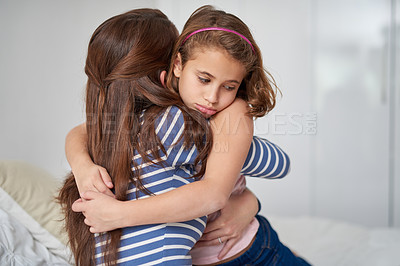 Buy stock photo Cropped shot of a mother hugging her sad daughter