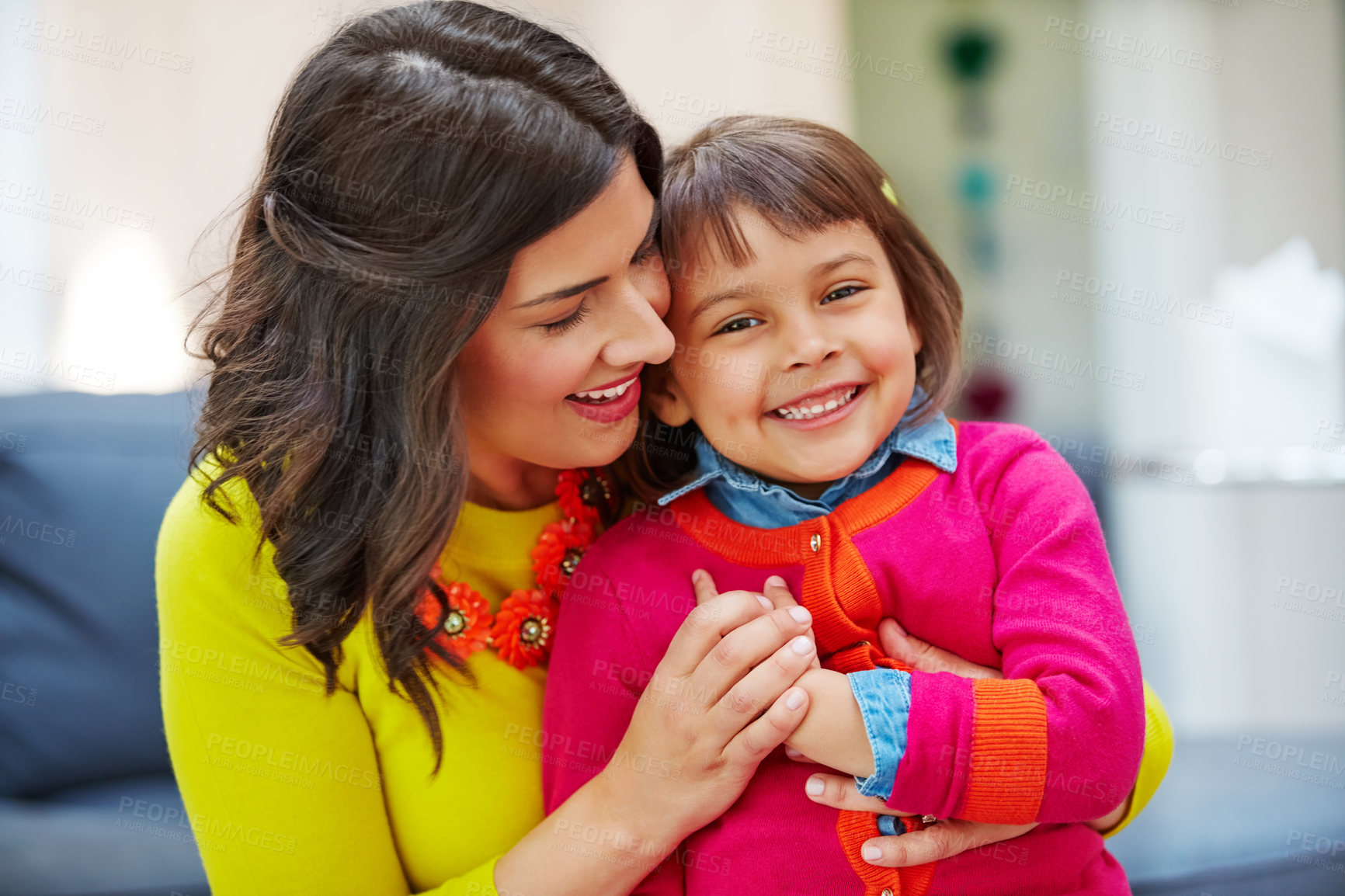 Buy stock photo Portrait of an adorable little girl and her mother bonding at home