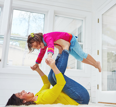 Buy stock photo Shot of an adorable little girl and her mother having fun at home