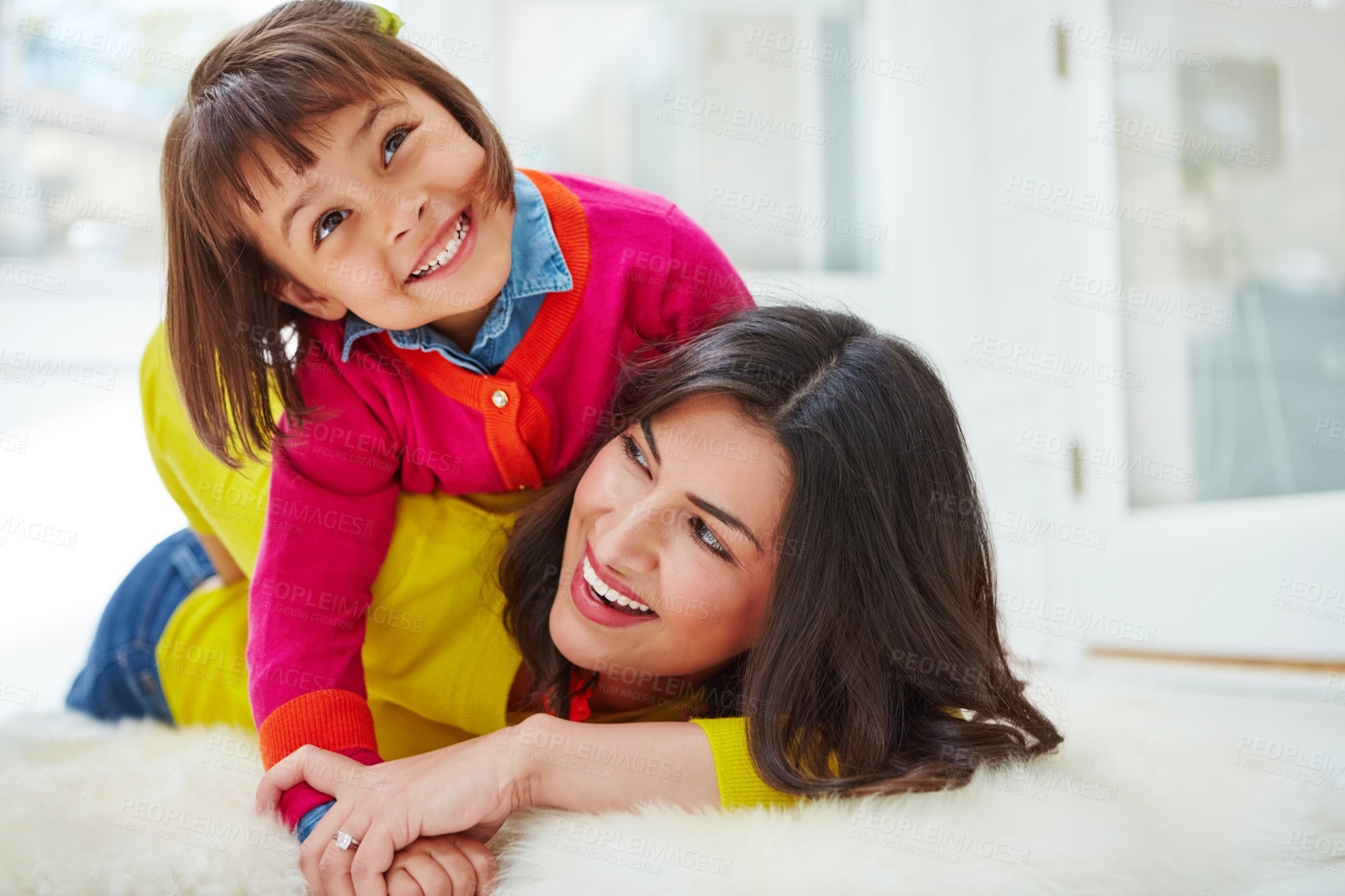 Buy stock photo Shot of an adorable little girl and her mother bonding at home