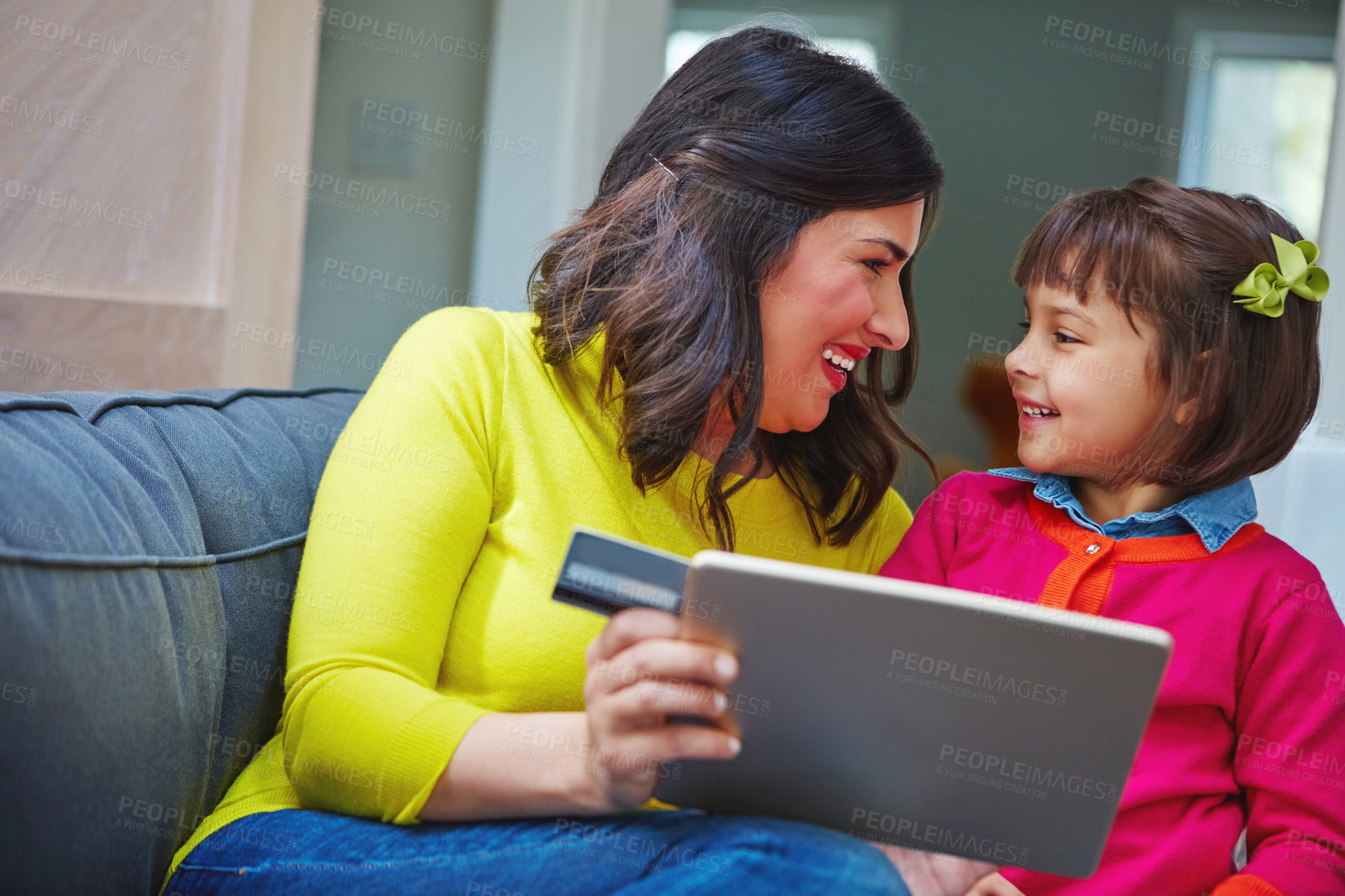 Buy stock photo Mother, credit card and tablet on couch with child for ecommerce, happy and pay subscription in lounge at home. People, smile and girl with fintech app, online shopping or discount deal at apartment
