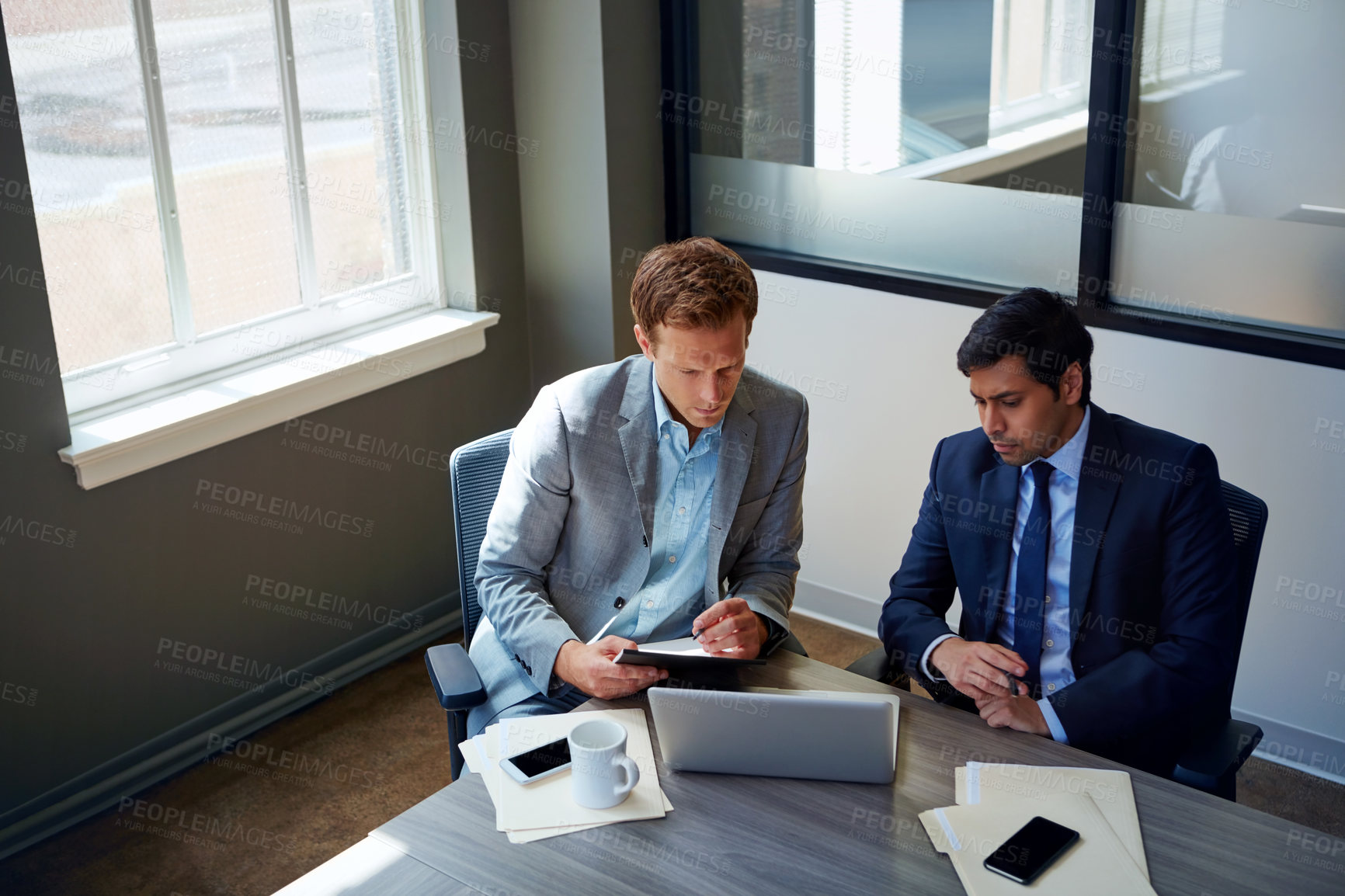 Buy stock photo Cropped shot of businessmen working in their office