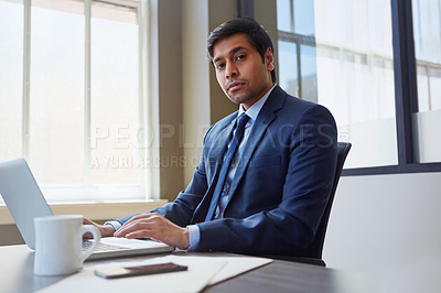 Buy stock photo Cropped portrait of a businessman working in his office