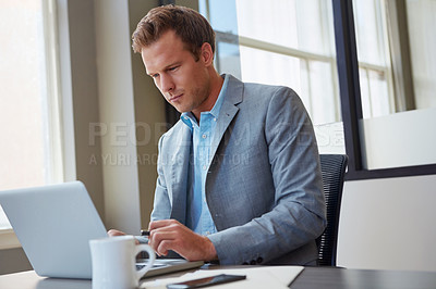 Buy stock photo Cropped shot of a businessman working in his office