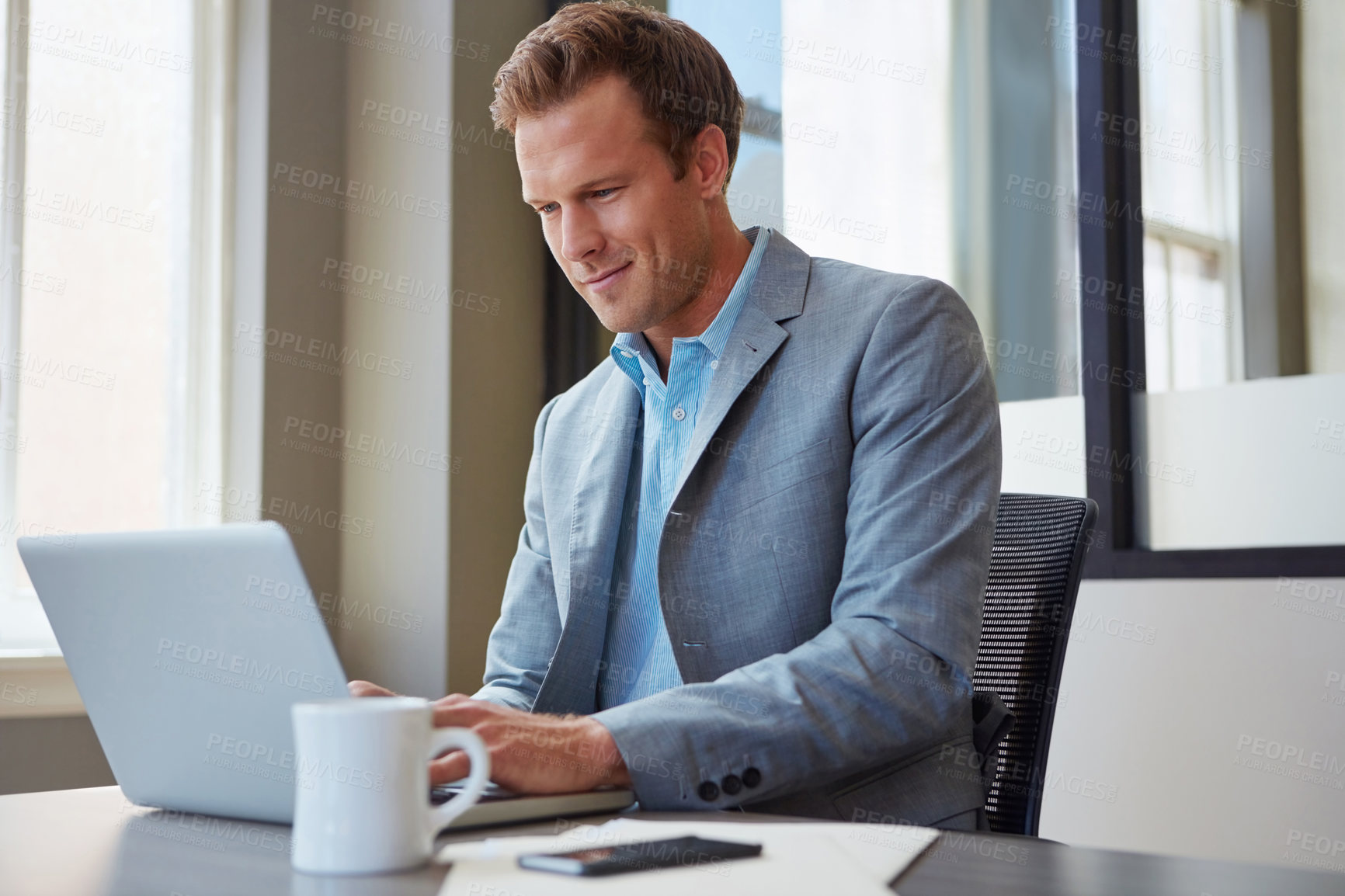 Buy stock photo Cropped shot of a businessman working in his office