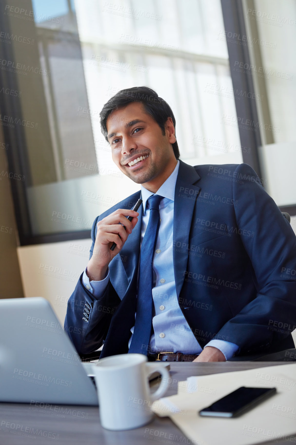 Buy stock photo Cropped portrait of a businessman working in his office