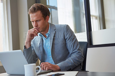 Buy stock photo Cropped shot of a businessman working in his office