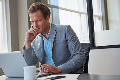 Buy stock photo Cropped shot of a businessman working in his office