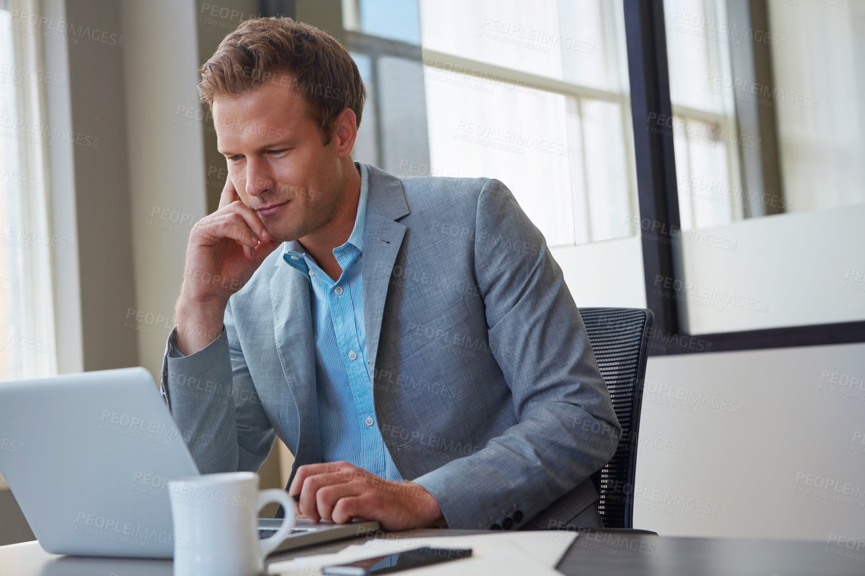 Buy stock photo Cropped shot of a businessman working in his office