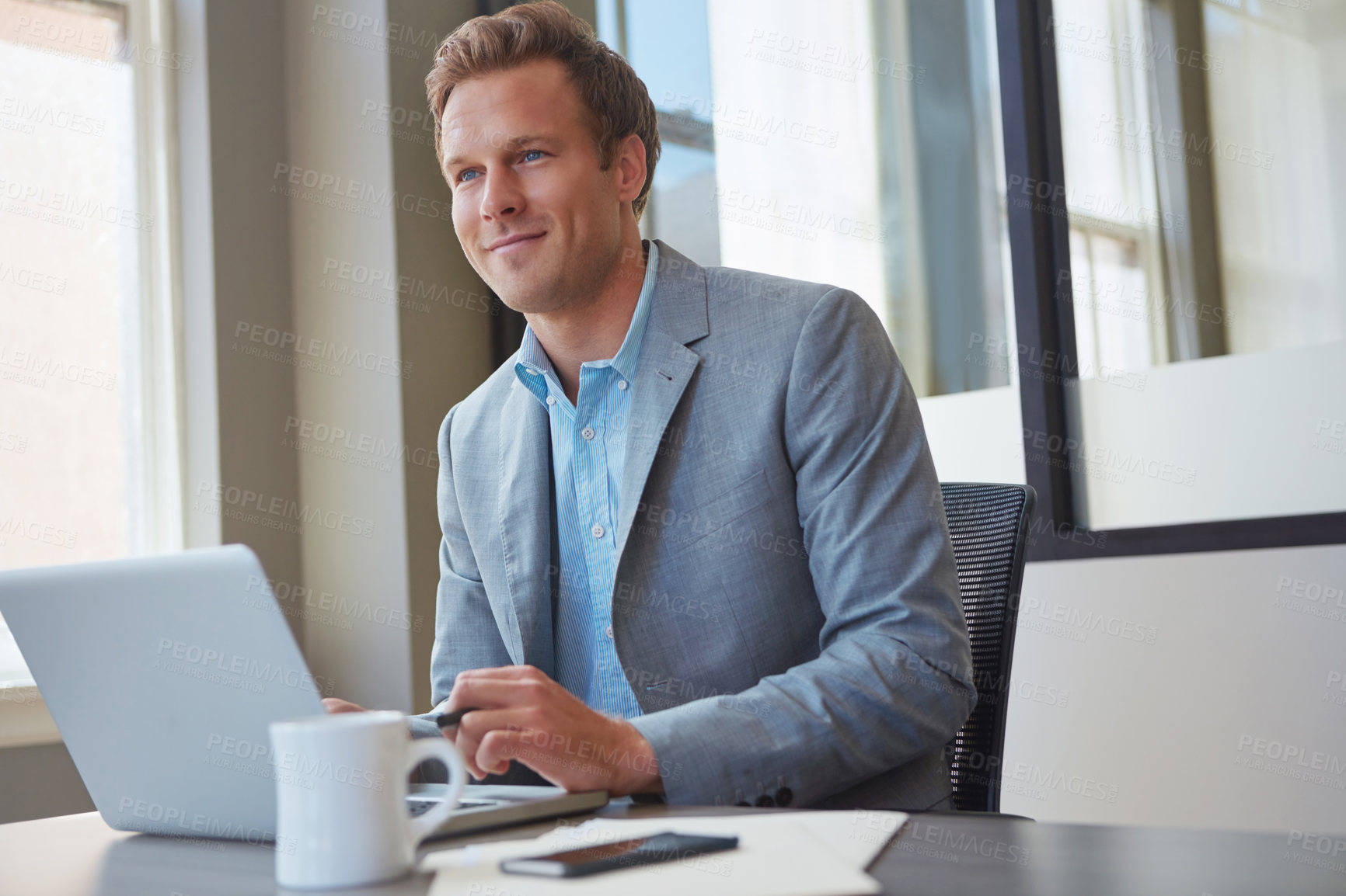 Buy stock photo Cropped shot of a businessman working in his office