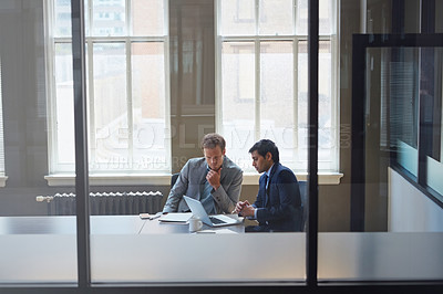 Buy stock photo Cropped shot of businessmen working in their office