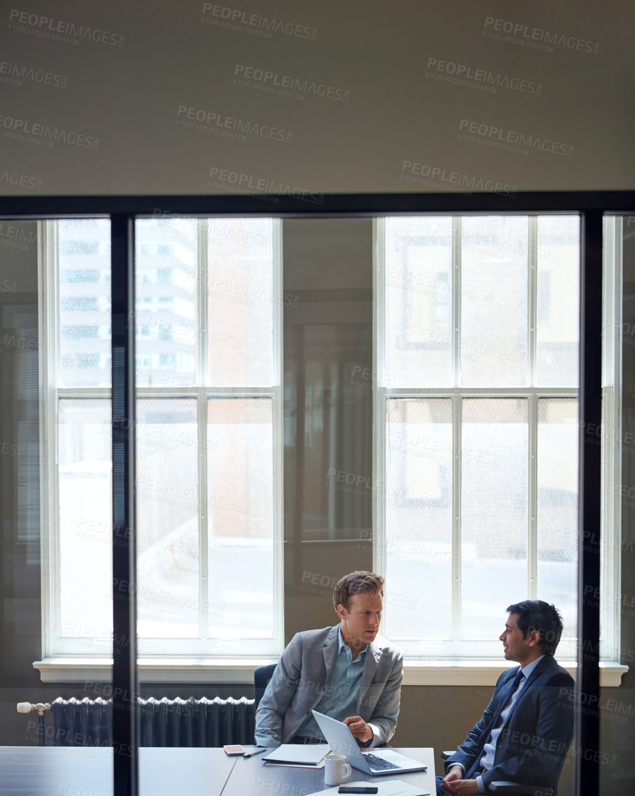 Buy stock photo Cropped shot of businessmen working in their office