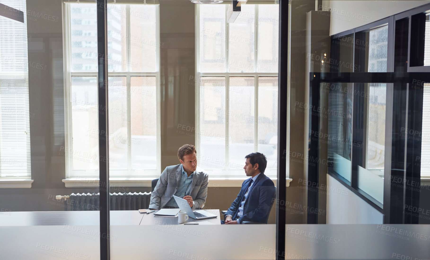 Buy stock photo Cropped shot of businessmen working in their office