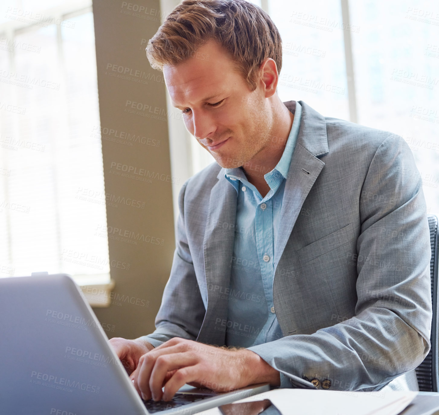 Buy stock photo Cropped shot of a businessman working in his office