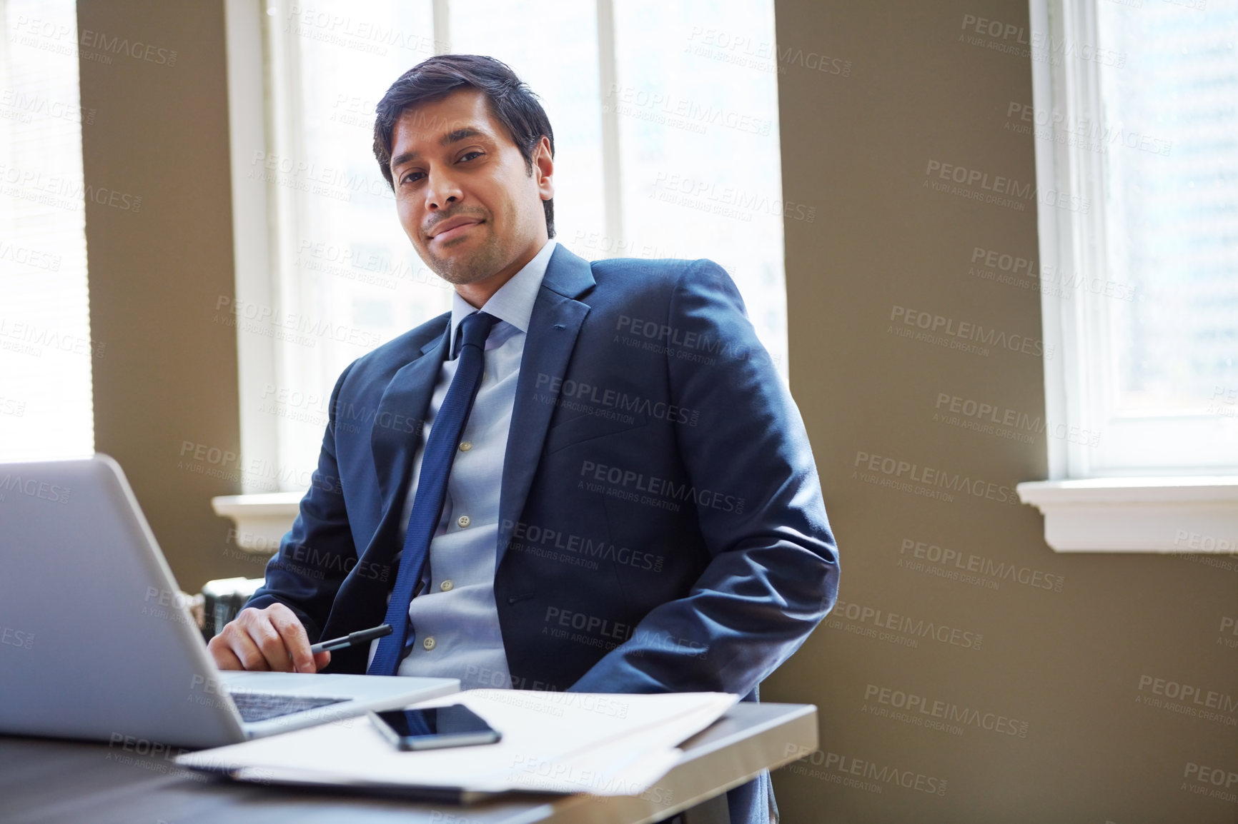 Buy stock photo Cropped portrait of a businessman working in his office