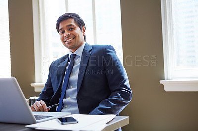 Buy stock photo Cropped portrait of a businessman working in his office