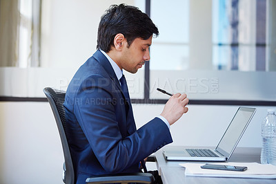 Buy stock photo Cropped shot of a businessman working in his office