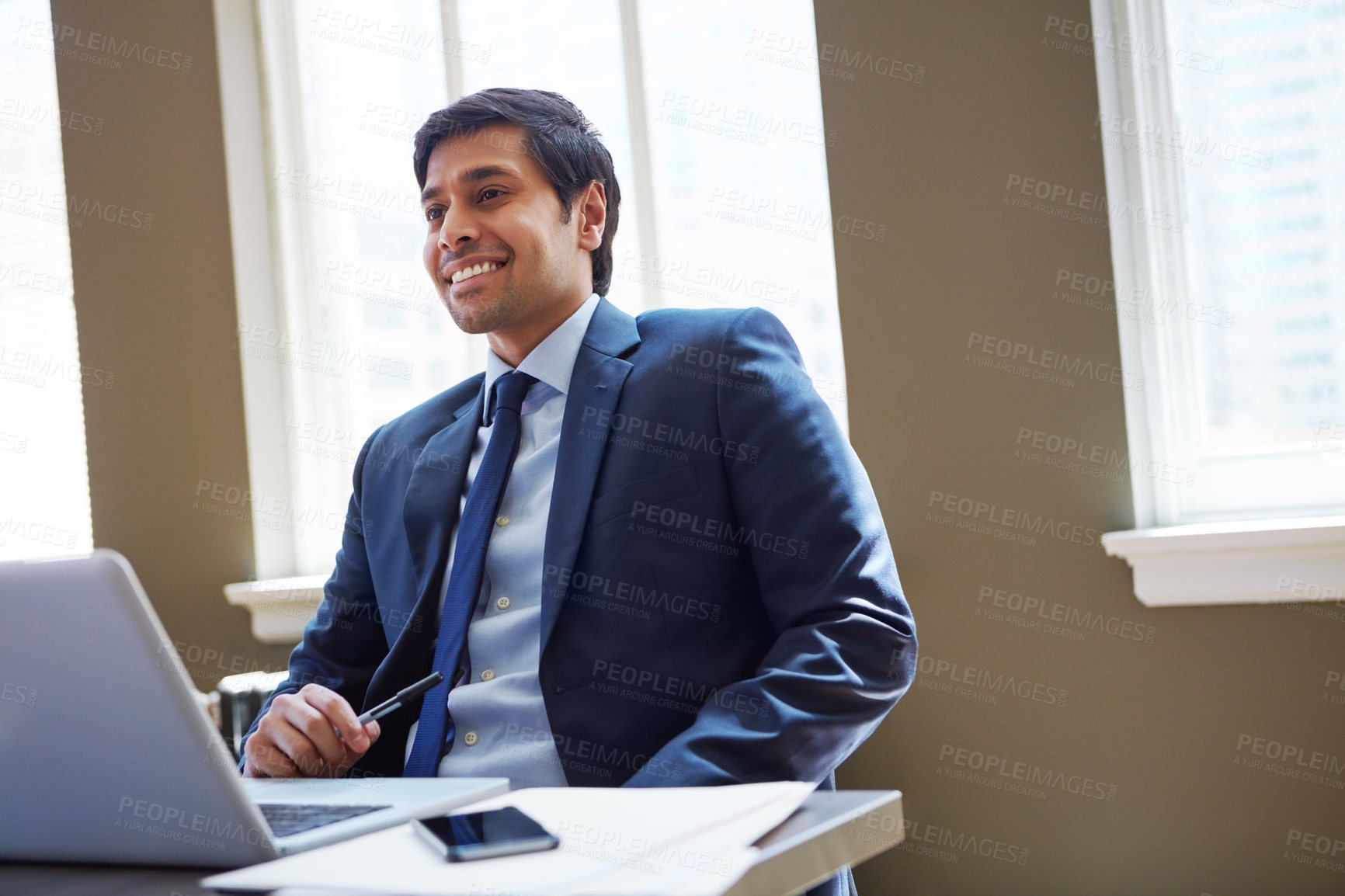 Buy stock photo Cropped shot of a businessman working in his office