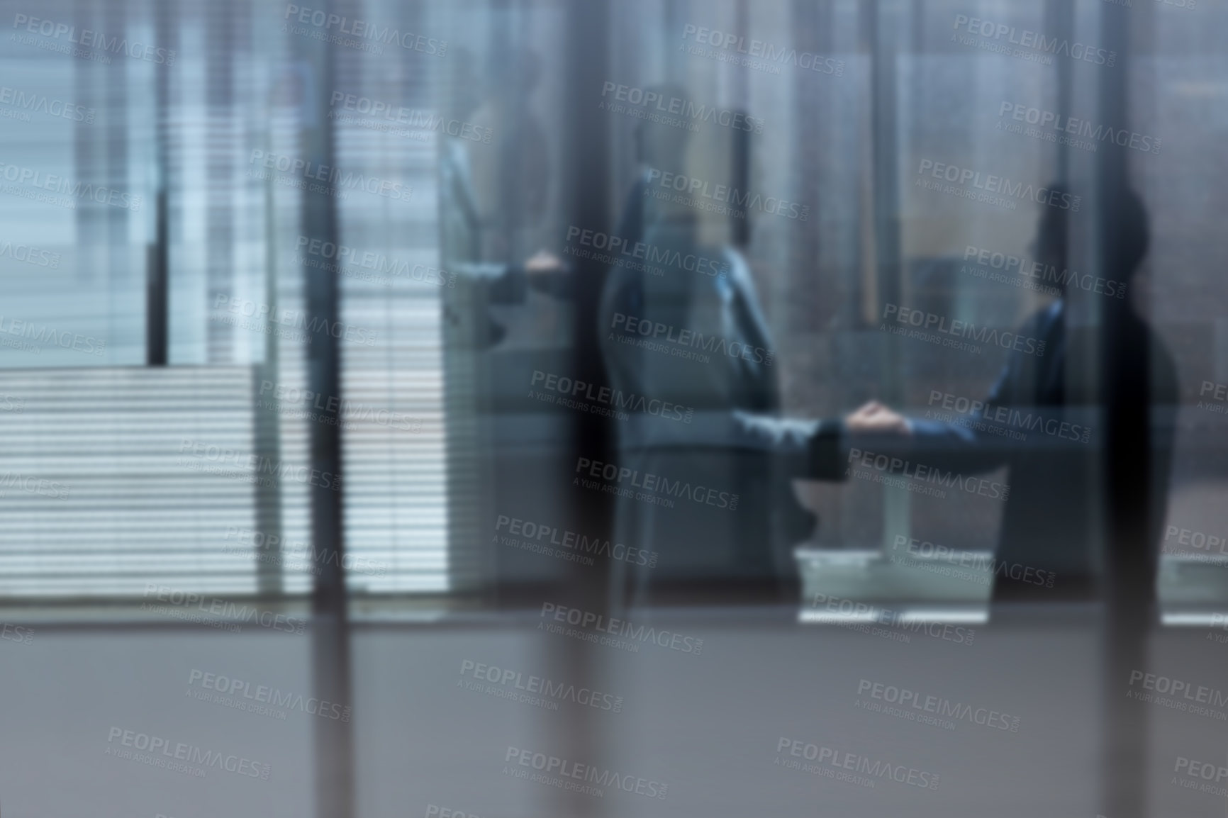 Buy stock photo Cropped shot of two businessmen shaking hands in the office