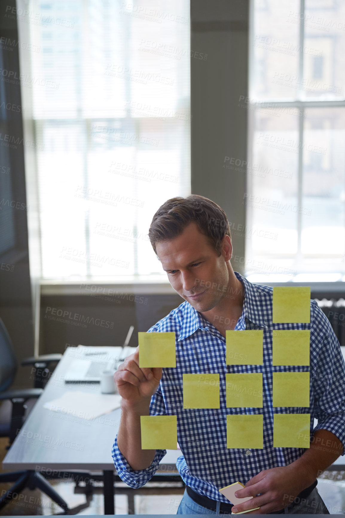 Buy stock photo Business, man and writing on sticky note in office for planning, schedule update and reminder. Glass, person and brainstorming with strategy, moodboard timeline and problem solving for proposal offer