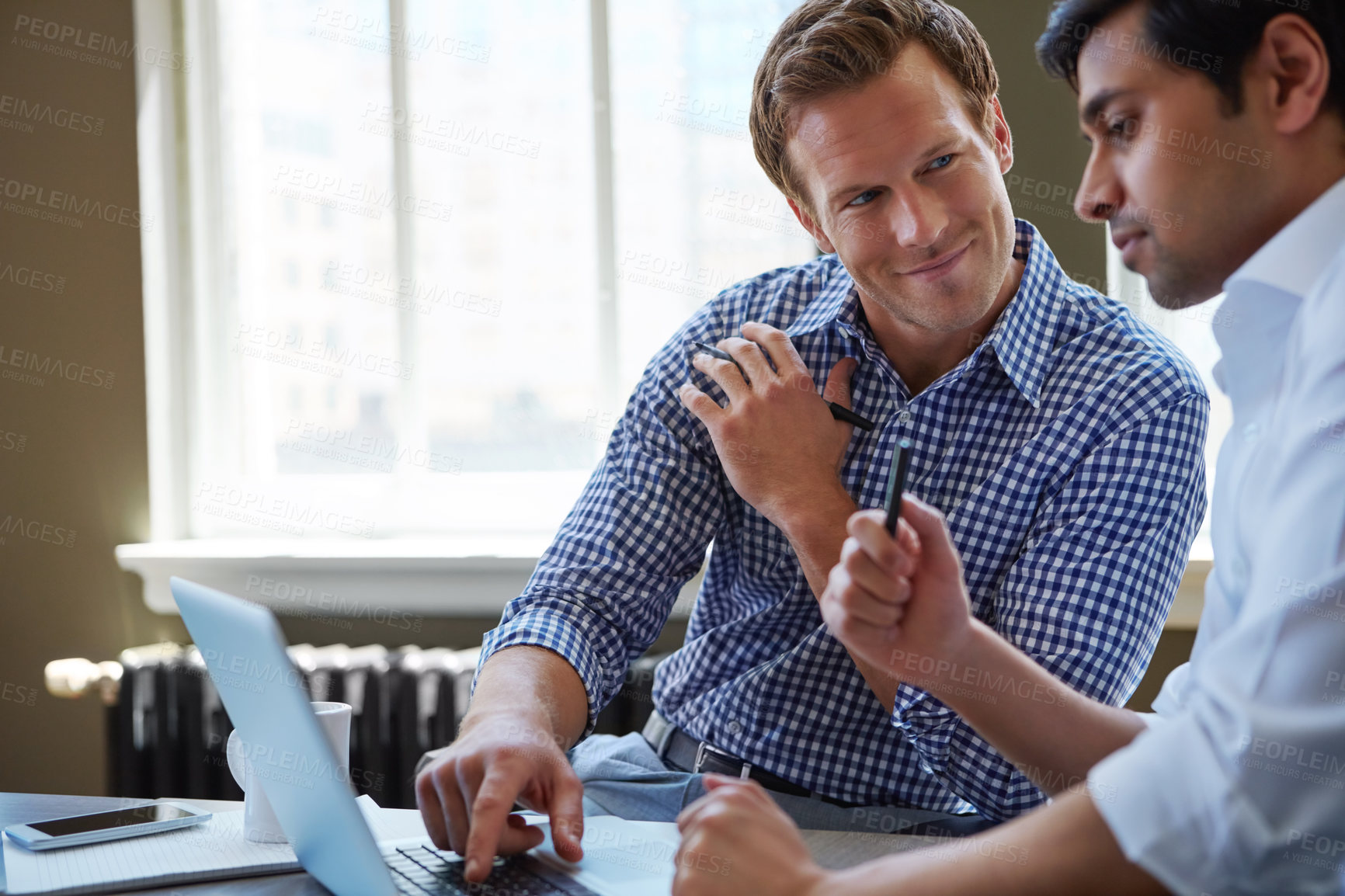 Buy stock photo Cropped shot of businessmen working in their office