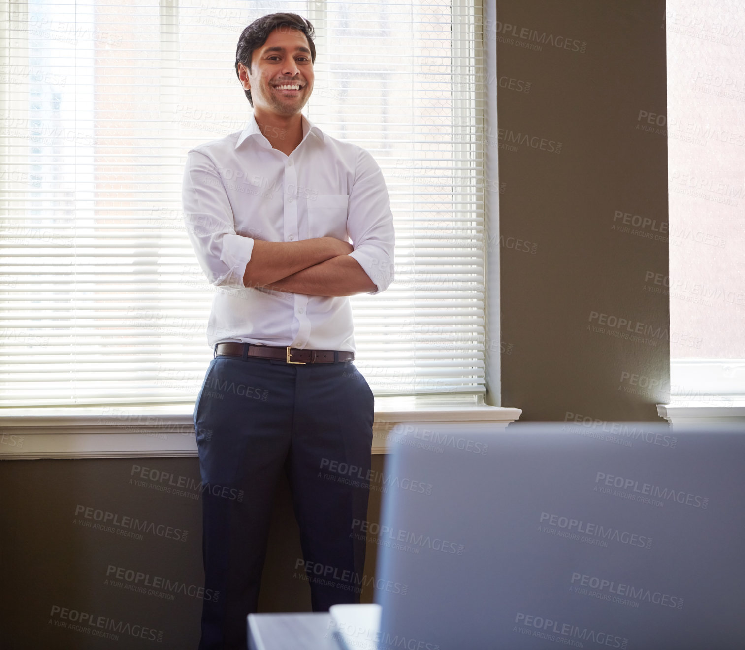 Buy stock photo Portrait of a handsome businessman in his office