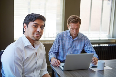 Buy stock photo Cropped shot of businessmen working in their office