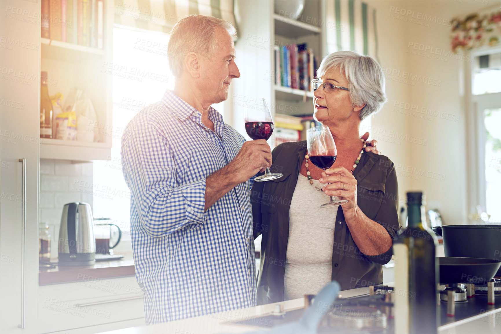 Buy stock photo Wine, toast or old couple hug in kitchen in celebration of marriage anniversary together in retirement at home. Cheers or senior woman drinking or bonding in a house with mature husband at dinner