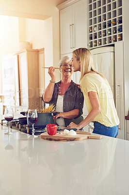 Buy stock photo Taste, woman or happy mother cooking food for a healthy vegan diet together with love in family home. Smile, tasting or adult daughter eating or helping senior mom in house kitchen at lunch or dinner