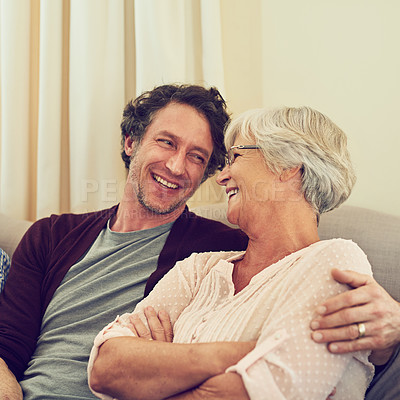 Buy stock photo Cropped shot of a man and his elderly mother sitting together at home