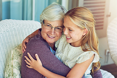 Buy stock photo Cropped shot of a young girl sitting outside with her grandmother