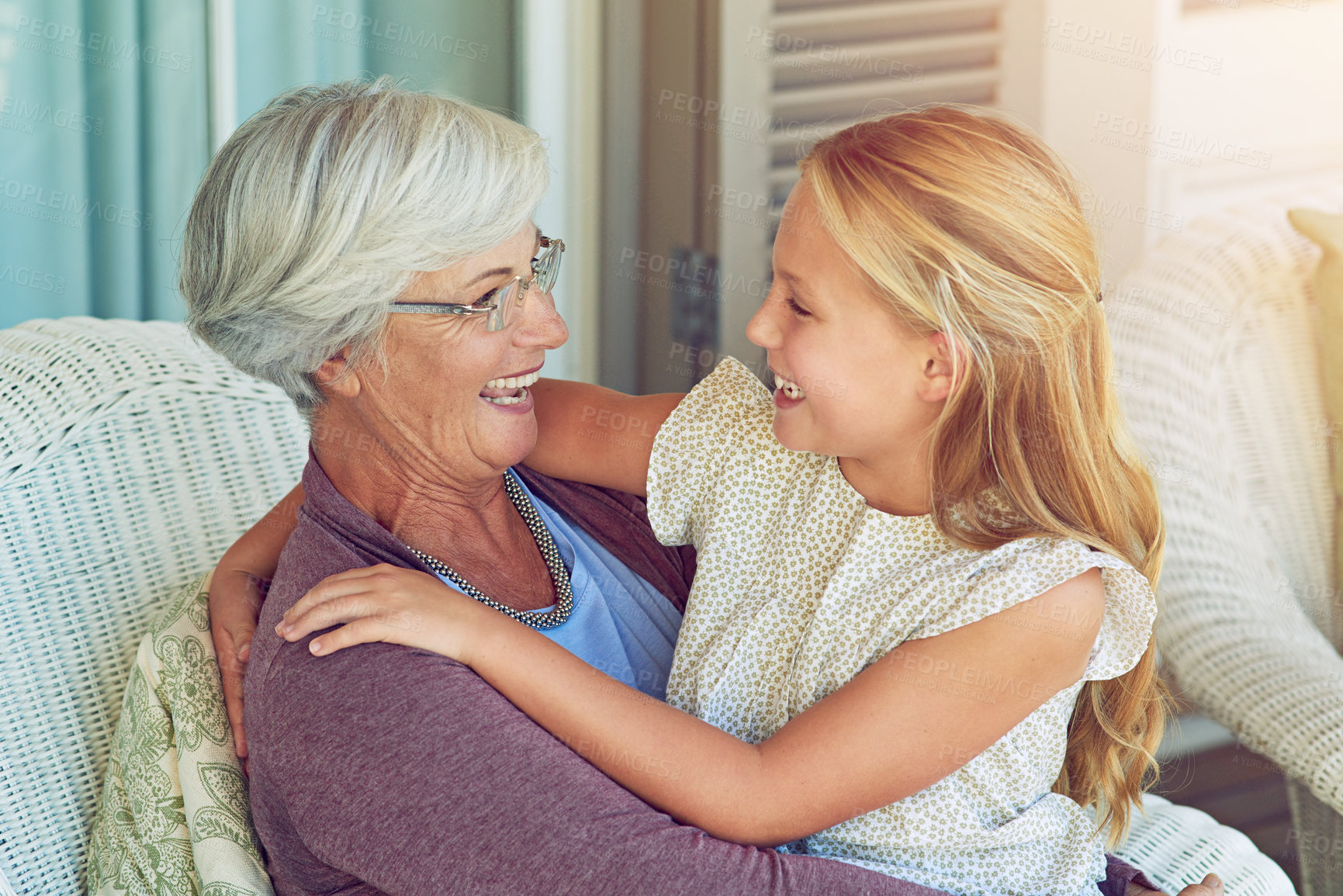 Buy stock photo Girl, grandmother and happy by house for hug, relax and love with development, care and relationship. Young child, grandma and comfort as family for generations, babysitting and bonding on weekend